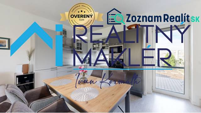 Küche im Einfamilienhaus mit Esstisch und Zugang zur Terrasse.