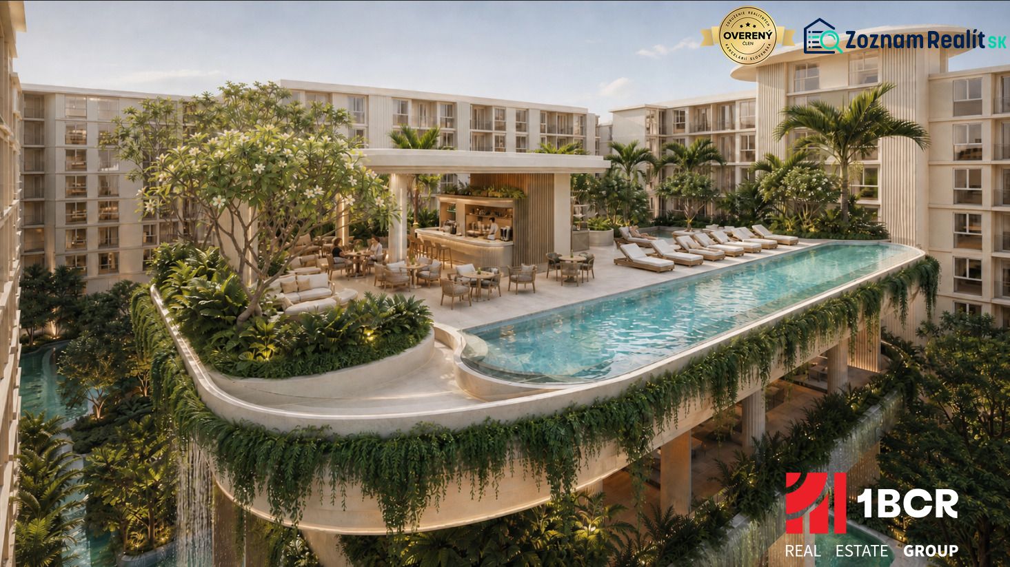 Wohnungsbau in Pattaya mit einem Pool auf der Terrasse, umgeben von üppigem Grün und Liegestühlen.