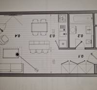 Grundriss einer 1-Zimmer-Wohnung mit Einrichtung: Küche, Badezimmer und Wohnzimmer mit Essbereich.
