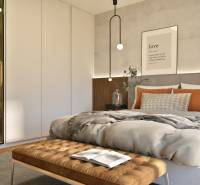 Schlafzimmer in einer 2-Zimmer-Wohnung mit Bett, Schrank und dekorativen Kissen.