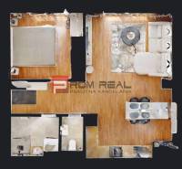 Grundriss einer 2-Zimmer-Wohnung mit Wohnzimmer, Schlafzimmer, Küche und Badezimmer.