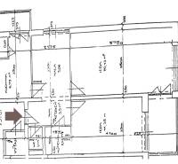 Grundriss einer 2-Zimmer-Wohnung mit Küche, Zimmer und Eingangsbereich.