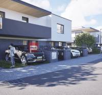 Straße mit stilvollen Häusern und Autos in Dubová, ideal für Bewohner von 3-Zimmer-Wohnungen.