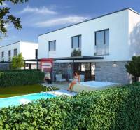 In Dubová sind weiße Gebäude mit einem Pool vor den 3-Zimmer-Wohnungen zu sehen.