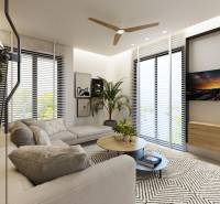 Wohnzimmer mit Sofa, Tisch und Pflanze in einer 3-Zimmer-Wohnung.