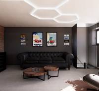 Ledersofa in Geschäftsräumen mit Vintage-Dekorationen an der Wand.