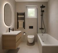 Badezimmer in einer 2-Zimmer-Wohnung mit Spiegel, Badewanne und Waschtisch.