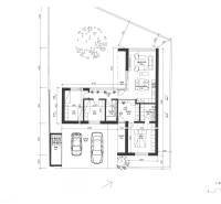 Grundriss eines Einfamilienhauses mit Darstellung der Zimmer, Küche, Garage und Terrasse.