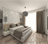 Ein Schlafzimmer in einem Einfamilienhaus mit Holzboden und gemusterten Tapeten.