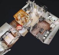 3D-Grundriss einer Zweizimmerwohnung mit Wohnzimmer, Küche, Badezimmer und Schlafzimmer.