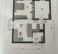 Grundriss einer 3-Zimmer-Wohnung mit Küche, Badezimmer, WC und Balkon.