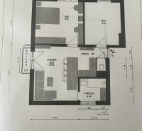 Grundriss einer 3-Zimmer-Wohnung mit Küche und Balkon, effiziente Raumnutzung.