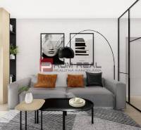 Wohnzimmer in einer Zweizimmerwohnung mit großem Sofa und modernen Dekorationen.