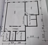 Grundriss einer 2-Zimmer-Wohnung umfasst Flur, Zimmer, Küche und Badezimmer.