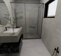 Badezimmer mit Waschbecken, Duschkabine und Fenster in einem Einfamilienhaus.