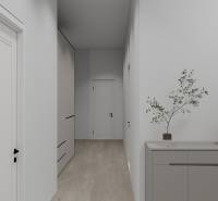 Der Flur in einem Einfamilienhaus mit einem Boden in Holzoptik und einfacher Einrichtung.