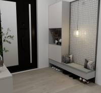 Innenraum eines Einfamilienhauses mit Holzboden, Eingangsbereich mit Sitzgelegenheit und Stauraum.