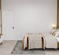 Schlafzimmer mit Holzboden, Bett und Fernseher in einem Einfamilienhaus.