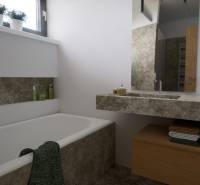 Ein Badezimmer mit Badewanne und Waschbecken, umgeben von natürlichen Dekoren und Stauraum.