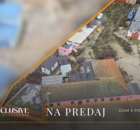 Zu verkaufen: Ein Einfamilienhaus mit älteren Gebäuden und Hof in Šintava.