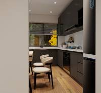 Küche in einer 3-Zimmer-Wohnung mit schwarzen Schränken und einem Boden in Holzoptik.