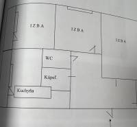 Grundriss einer 3-Zimmer-Wohnung mit Küche, Badezimmer und WC.