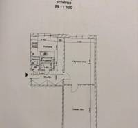 Grundriss einer 2-Zimmer-Wohnung mit Bezeichnung der Räume: Küche, Badezimmer, Wohnzimmer, Flur.