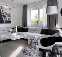 Ein stilvolles Wohnzimmer mit einer Eckcouch und dekorativen Elementen in einer 3-Zimmer-Wohnung.