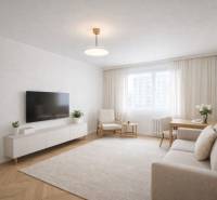 Wohnzimmer in einer Einzimmerwohnung mit Holzboden, hellen Möbeln und einem Fernseher.