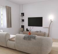 Wohnzimmer in einer 3-Zimmer-Wohnung mit einem bequemen Sofa und einem Fernseher an der Wand.