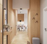 Der Flur in der 4-Zimmer-Wohnung mit einem Boden in Holzoptik, der zum Esszimmer führt.