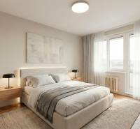 Schlafzimmer in einer 2-Zimmer-Wohnung mit einem großen Bett und einem Boden in Holzoptik.