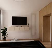 Schlafzimmer in einer 3-Zimmer-Wohnung mit Holzboden, Fernseher und Schrank.