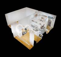 3D Grundriss einer Einzimmerwohnung mit Holzboden.