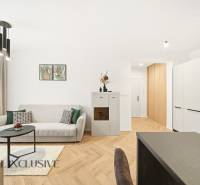 Wohnzimmer in einer 4-Zimmer-Wohnung mit Holzboden und minimalistischer Dekoration.