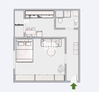 Grundriss einer Einzimmerwohnung mit Balkon, Badezimmer und Küche.