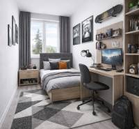 Ein Zimmer mit Holzboden, einem Bett und einem Schreibtisch in einer 3-Zimmer-Wohnung.