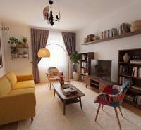 Ein stilvolles Wohnzimmer in einer Zweizimmerwohnung mit einem bequemen Sofa und Holzregalen.