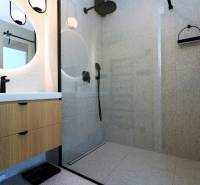 Duschkabine mit Glastüren und Waschbecken in einer 4-Zimmer-Wohnung.
