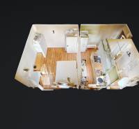 3D-Grundriss einer Einzimmerwohnung mit Holzboden.