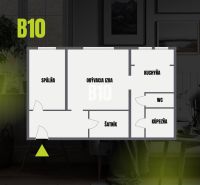 Grundriss einer 2-Zimmer-Wohnung mit Wohnzimmer, Schlafzimmer, Küche, Badezimmer und Ankleidezimmer.