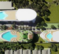 Luftaufnahme des Wohnungsbaus in Phuket mit Dachpools und Grünflächen.