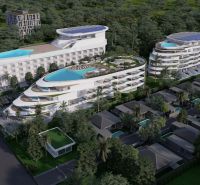 Wohnungsbau in Phuket mit wellenförmigem Design und Dachpools, eingebettet in Grün.