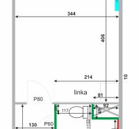 Grundriss eines Einzimmerapartments mit Küchenzeile und Badezimmer mit Waschmaschine und Toilette.