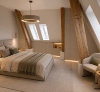 Ein Schlafzimmer im Dachgeschoss mit Holzelementen und einem bequemen Sessel in einer 2-Zimmer-Wohnung.
