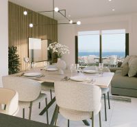 Essbereich des Ferienapartments mit Meerblick und elegantem Gedeck.