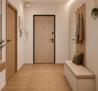 Eingangsbereich mit Holzboden, Spiegel und dekorativen Elementen in einer 3-Zimmer-Wohnung.