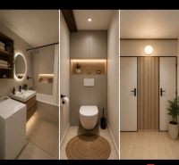 Badezimmer mit Badewanne und Spiegel, modernes WC und Eingangstür in einer 2-Zimmer-Wohnung.