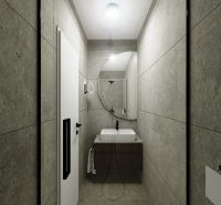Badezimmer in einer 3-Zimmer-Wohnung mit Waschbecken, Spiegel und grauen Wänden.