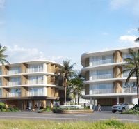 Wohnungsbau in Surat Thani mit Palmen und moderner Architektur.